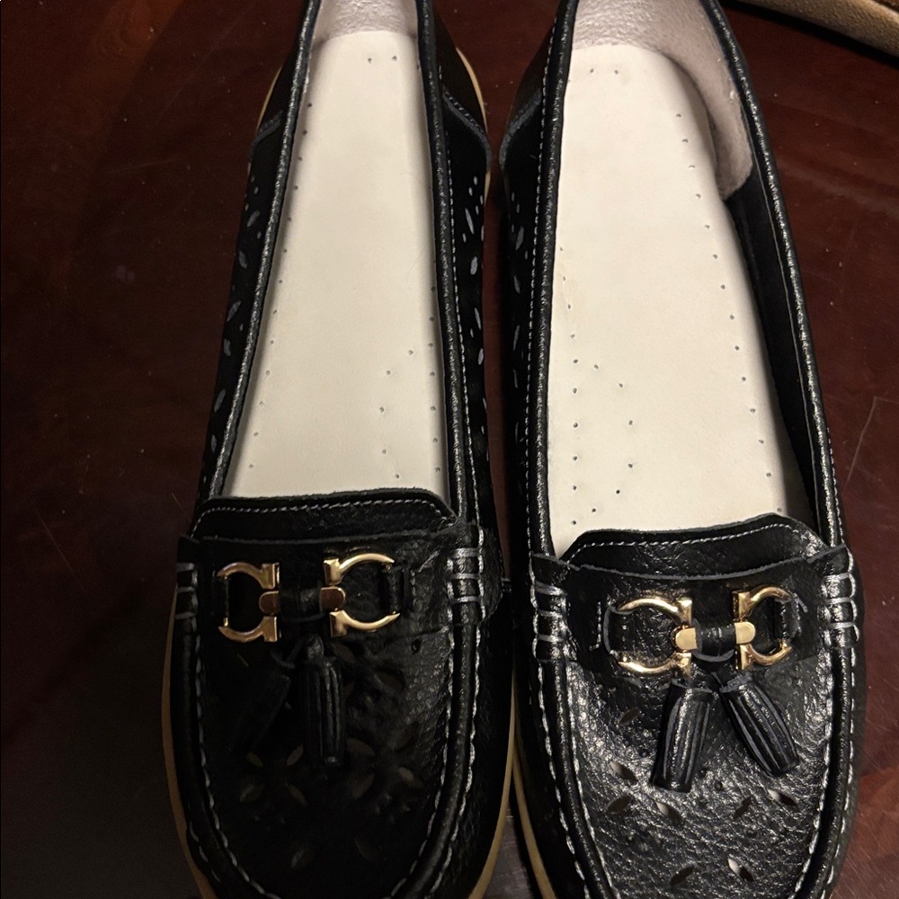 Elegant Black Loafers for Women with gold buckle and tassel